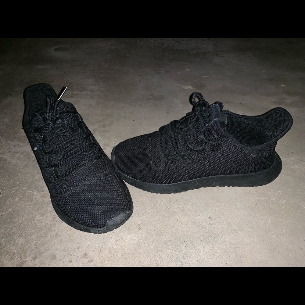 Grade school black adidas tubular sneakers